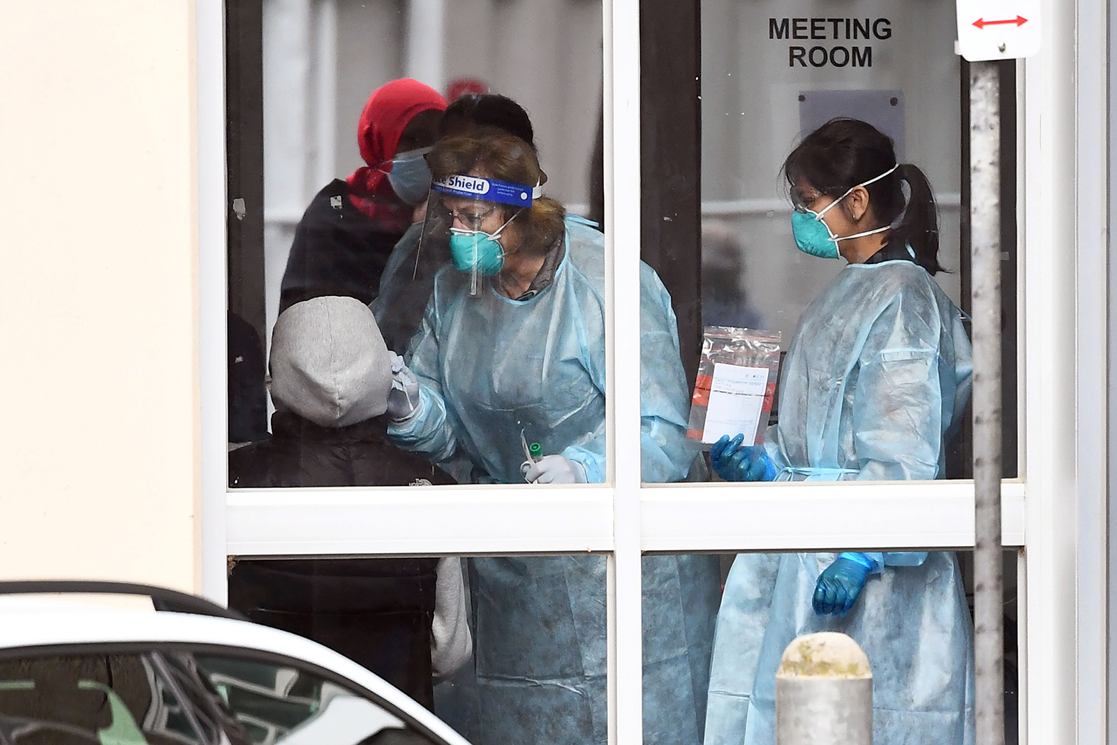 Medical staff perform a Covid-19 test on a resident of one of nine public housing estates locked down due a spike in infection numbers in Melbourne on July 6.