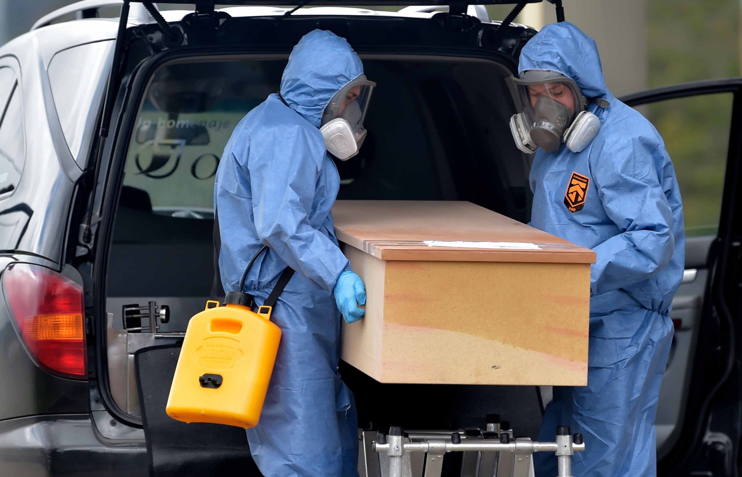 Workers move the coffin of a Covid-19 victim in Bogota, Colombia, on July 4.